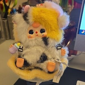 Baby Three (BB3) Vehicle-Mounted Plush figure in the Calico Cow design. 